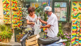 Cefalù - Pescivendolo con una Vespa