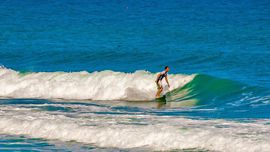 Surfing at the beach of Cefalu