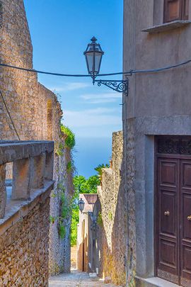 A typical narrow street in the charming Medieval mountain town of Erice
